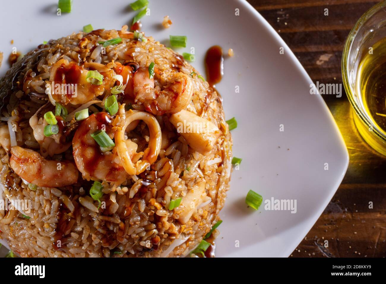 Arroz con mariscos rice whit seafood prawns typical peruvian food in wood table Stock Photo