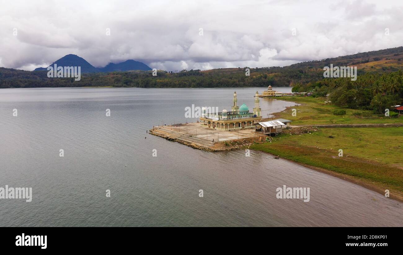 Aerial drone of Mosque on the shore of lake Lanao. Mindanao, Lanao del Sur, Philippines. Stock Photo