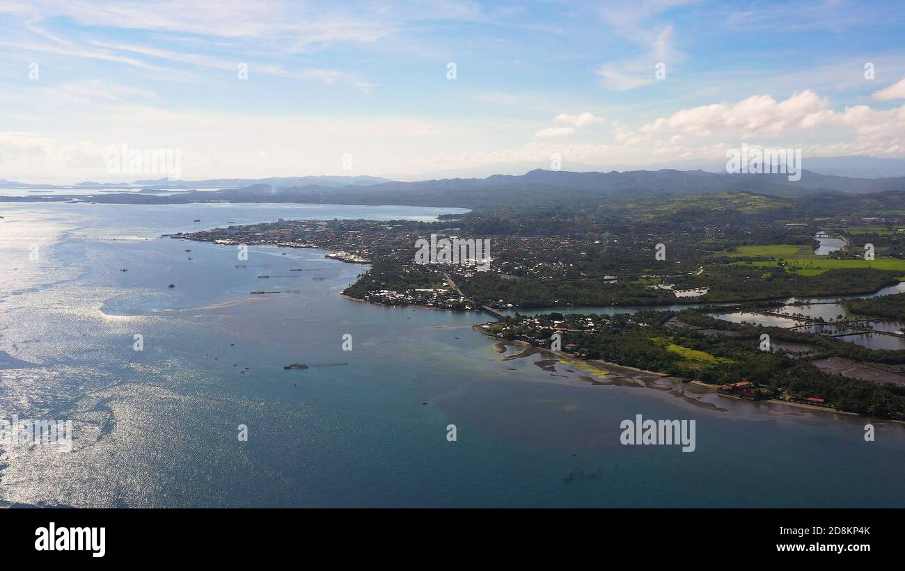 Panorama of the city of Surigao against the background of the sea and mountains. Surigao City, Surigao del Norte. Stock Photo