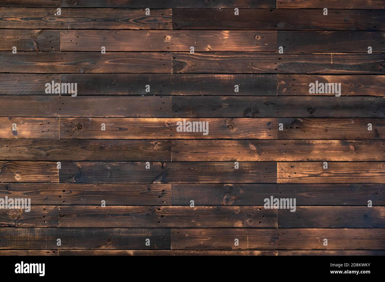 Burnt dark wooden plank natural texture background Stock Photo