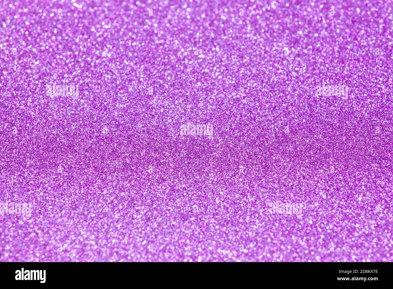 Holographic bright purple glitter real texture background Stock Photo -  Alamy