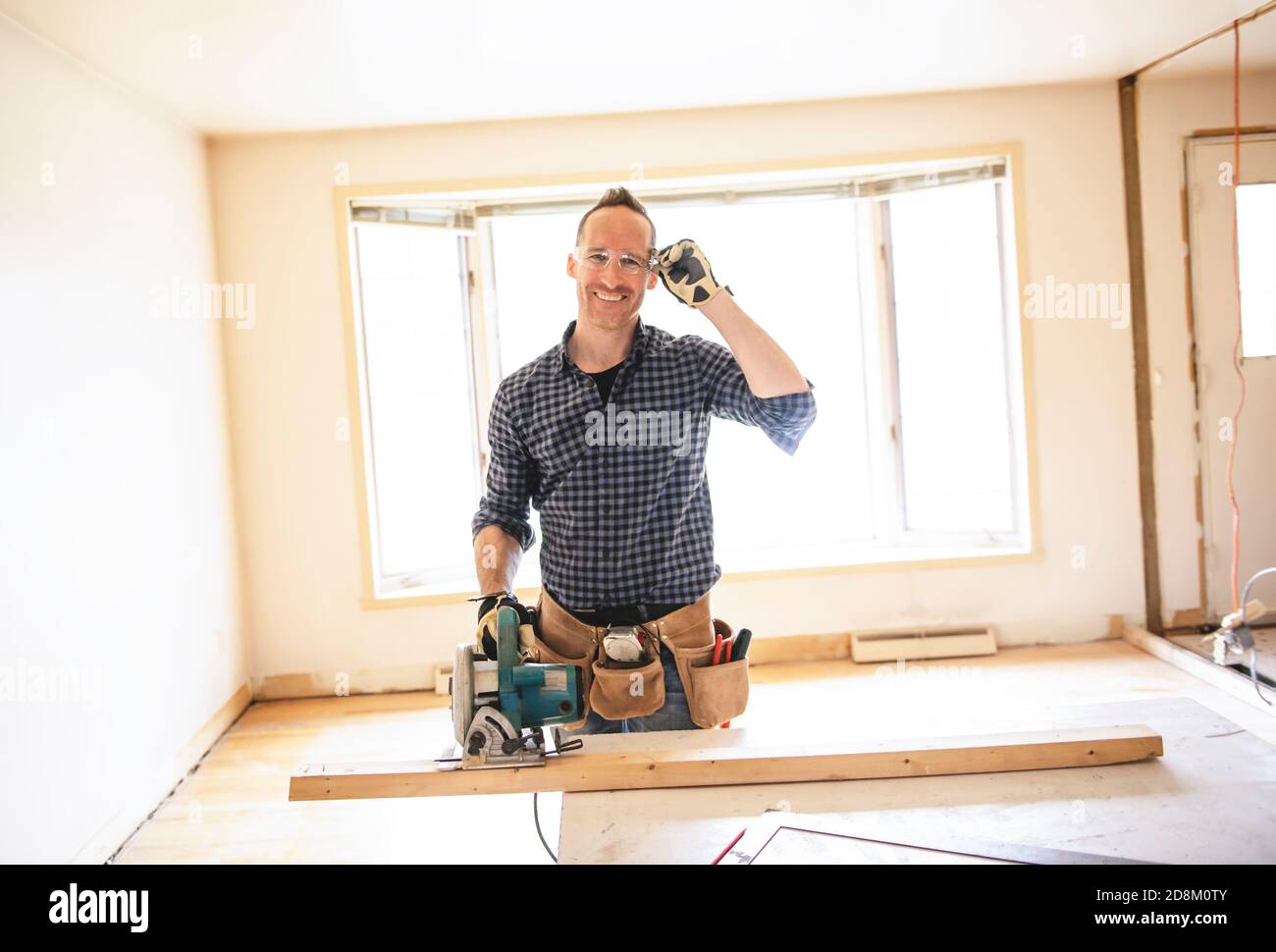 A man worker in the carpenter workroom renovation Stock Photo Alamy