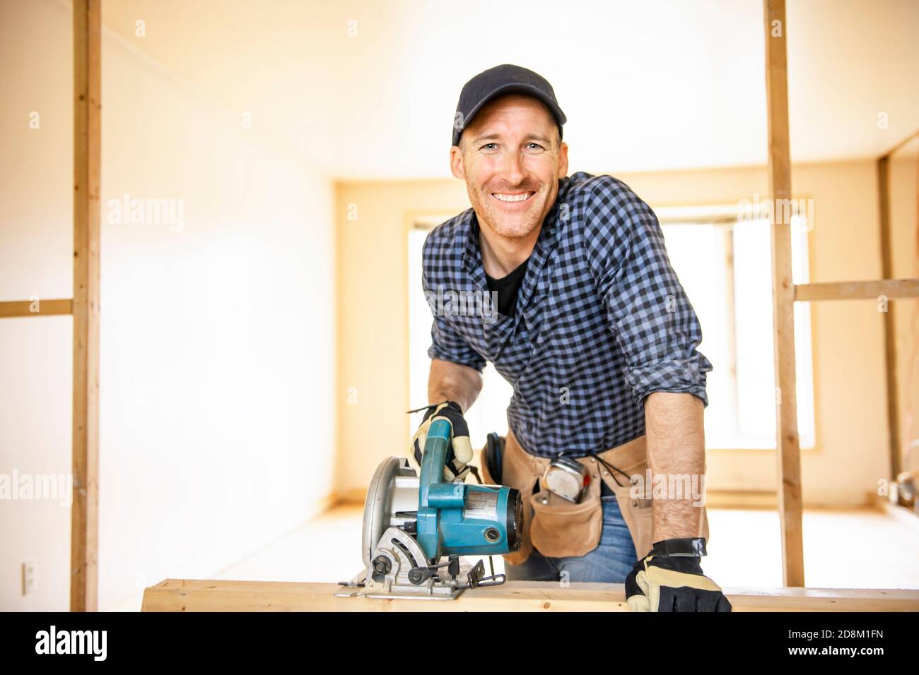 A man worker in the carpenter workroom renovation Stock Photo Alamy