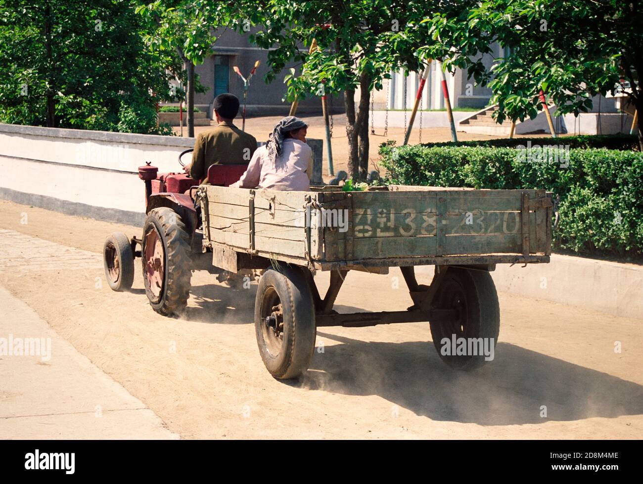 Old tractor and trailer at a collective farm near Wonsan, North Korea Stock Photo