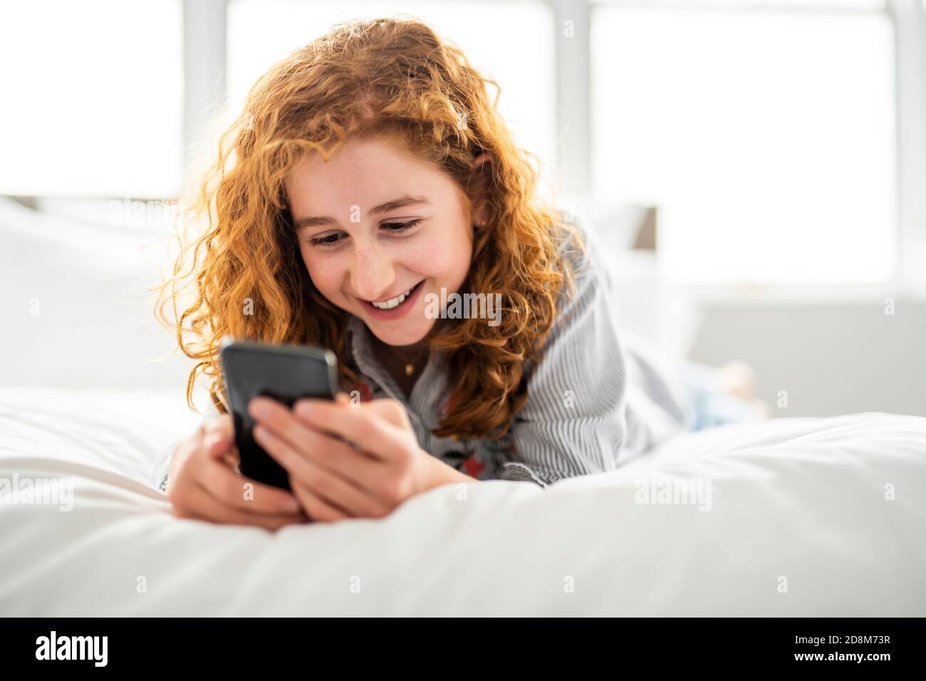 Teen laying on bed hi-res stock photography and images - Alamy