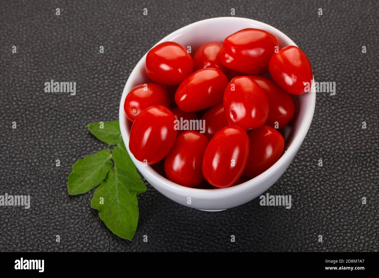 Sweet Red cherry tomatoes in the bowl Stock Photo - Alamy