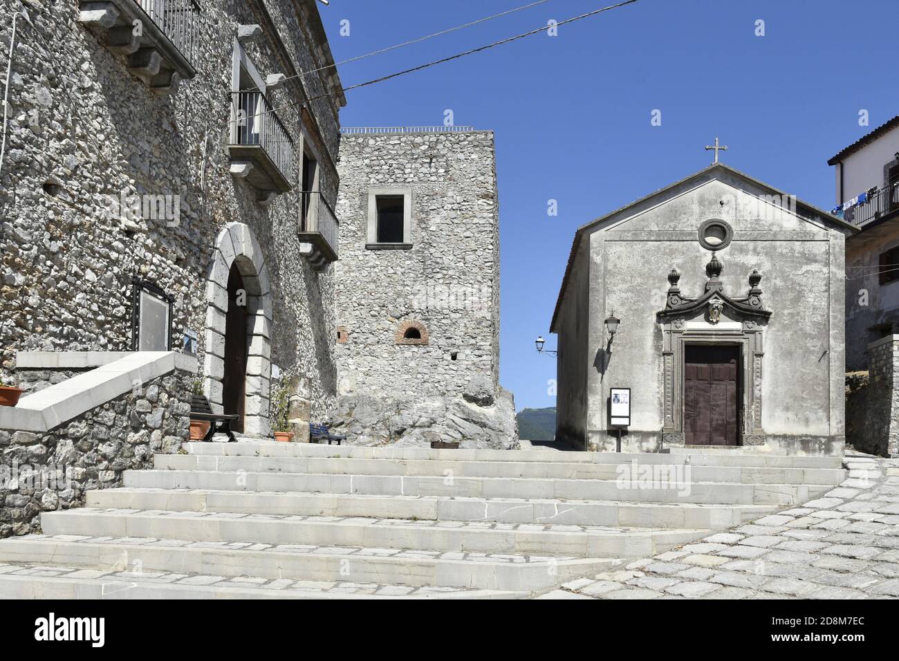 A narrow street among the old houses of Aieta, a rural village in the