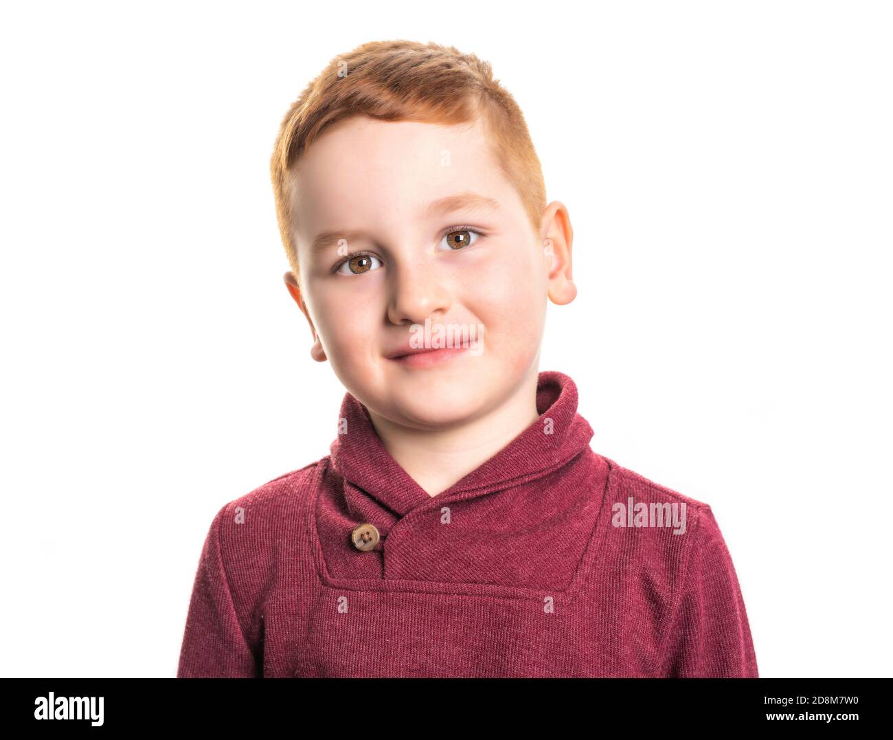 A Cute redhead boy in studio white background Stock Photo