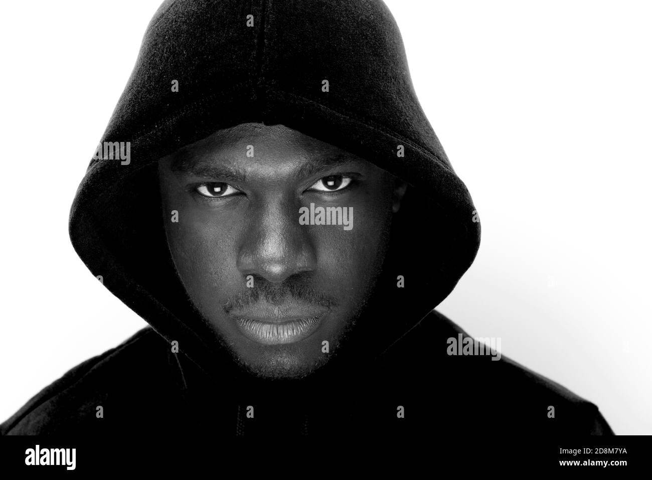 Close up black and white portrait of young black man with hoodie Stock ...