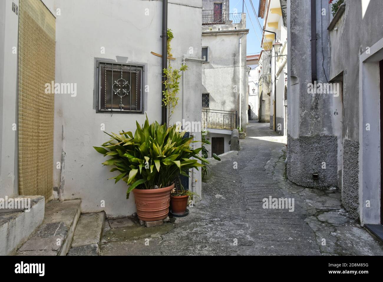 A narrow street among the old houses of Aieta, a rural village in the