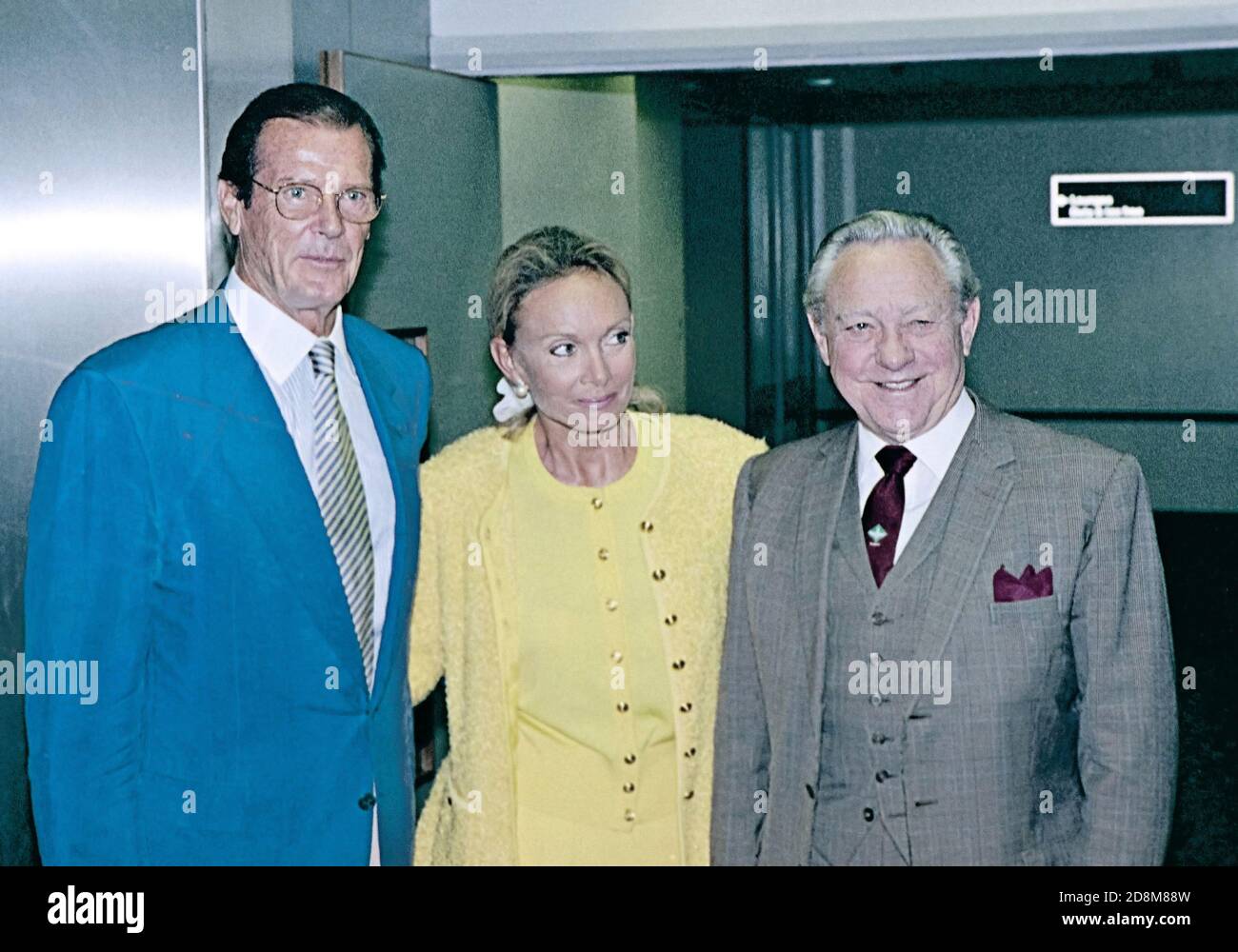 Actor Roger Moore with girlfriend Kiki and fellow actor Richard Todd Stock Photo