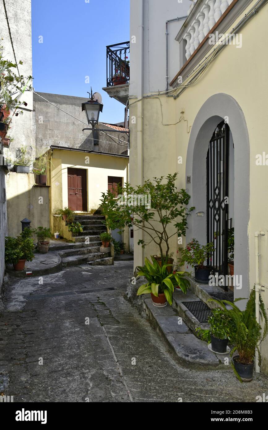 A narrow street among the old houses of Aieta, a rural village in the
