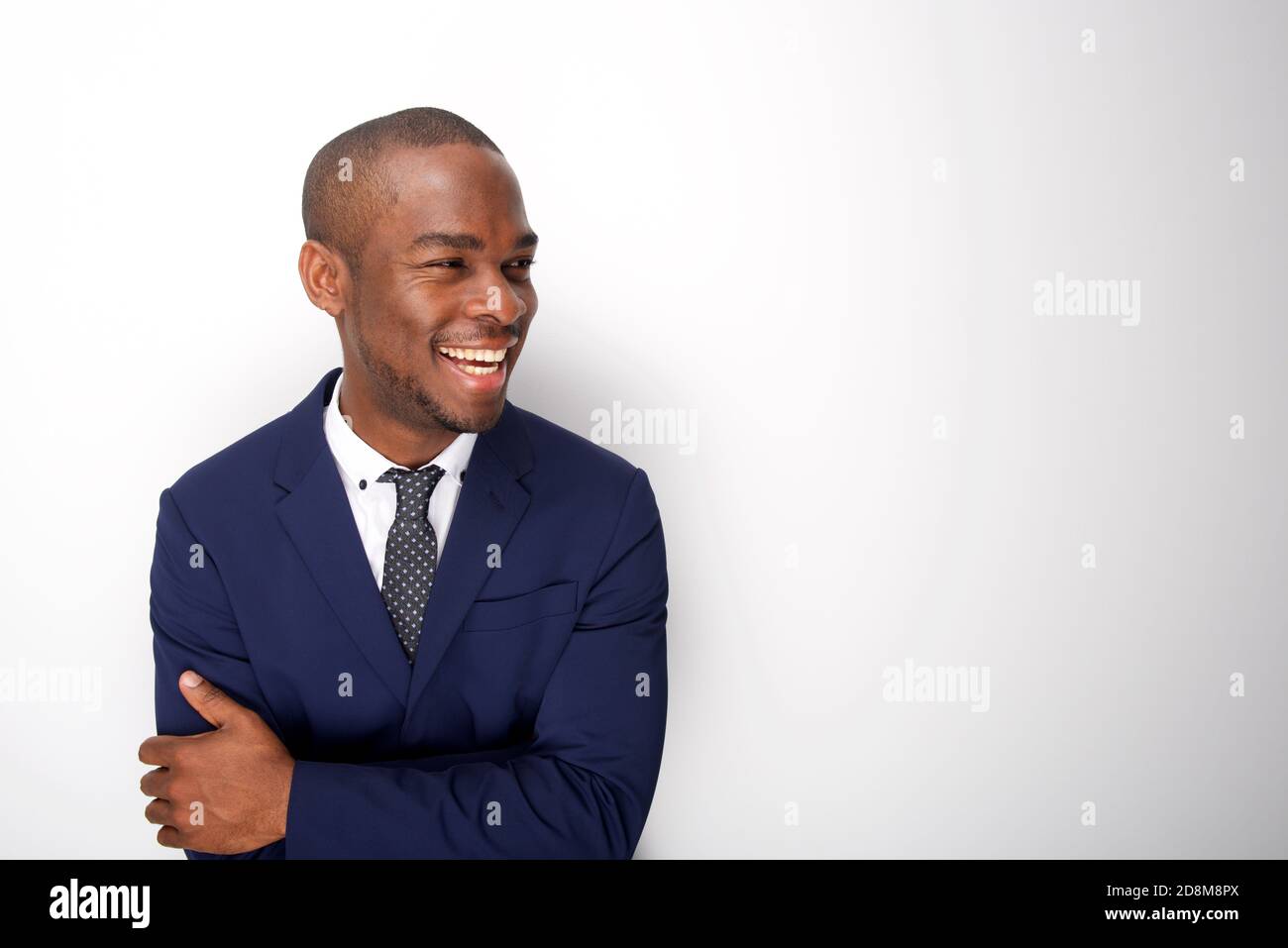 Portrait of happy african american man in business suit against white ...