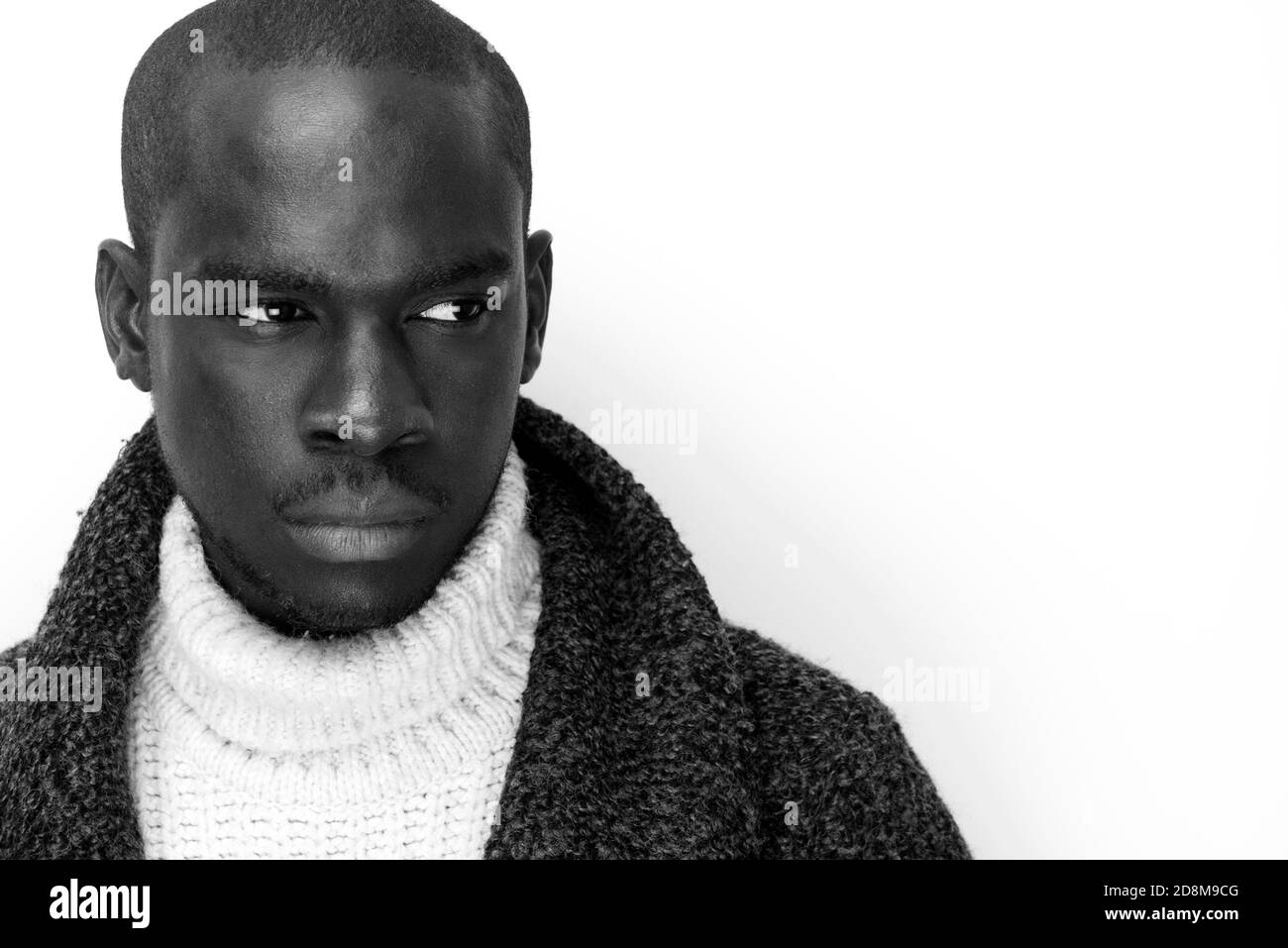 Close up black and white portrait of handsome young black man against ...