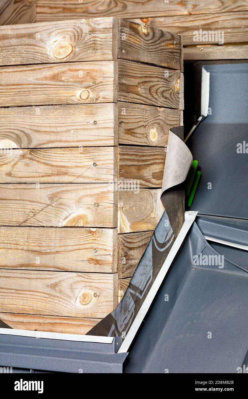 Wooden chimney frame on the roof of the house in the process of