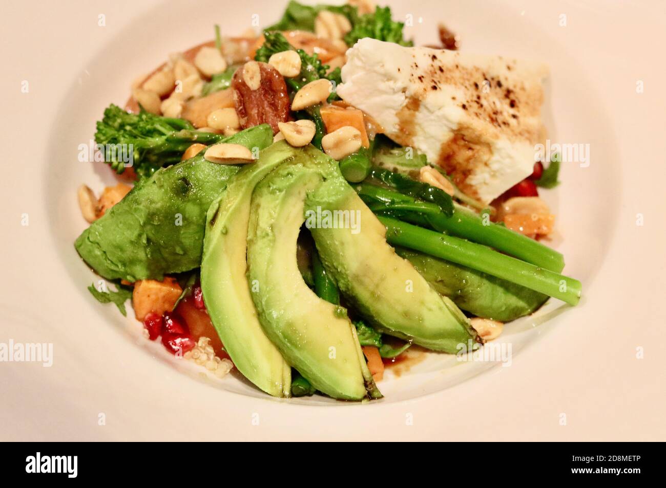 Healthy vegetarian salad meal with sliced avocado broccoli and feta cheese Stock Photo Alamy