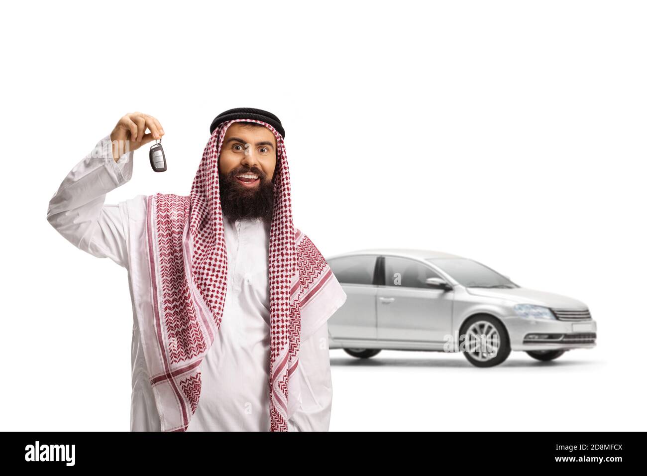 Arab man with a silver car showing car keys isolated on white background Stock Photo