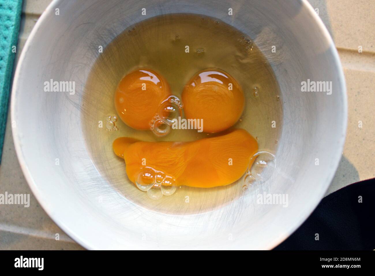 Egg yolks face Stock Photo Alamy