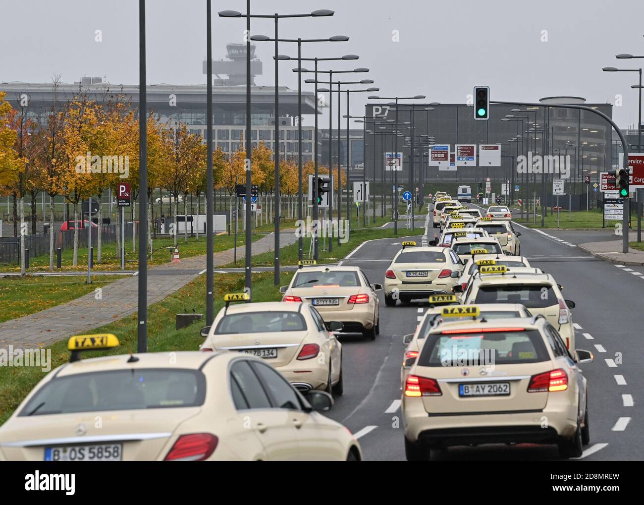 31 October 2020, Brandenburg, Schönefeld: Berlin taxi drivers are on a parade in the direction of the capital airport Berlin Brandenburg "Willy Brandt" (BER). The airport was opened on 31.10.2020 after a long delay. The Berlin taxi drivers started with their parade in Tegel. At this rally, they are demanding that all 7000 Berlin taxis be given loading rights at BER in future, not just 300 as previously planned. Photo: Patrick Pleul/dpa-Zentralbild/ZB Stock Photo