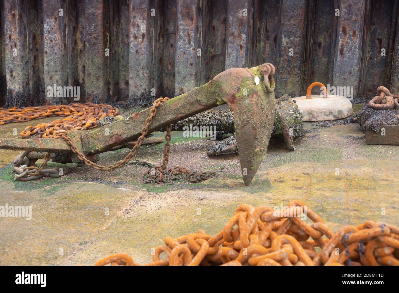 Very old ships anchor rusted and left in shipyard Stock Photo