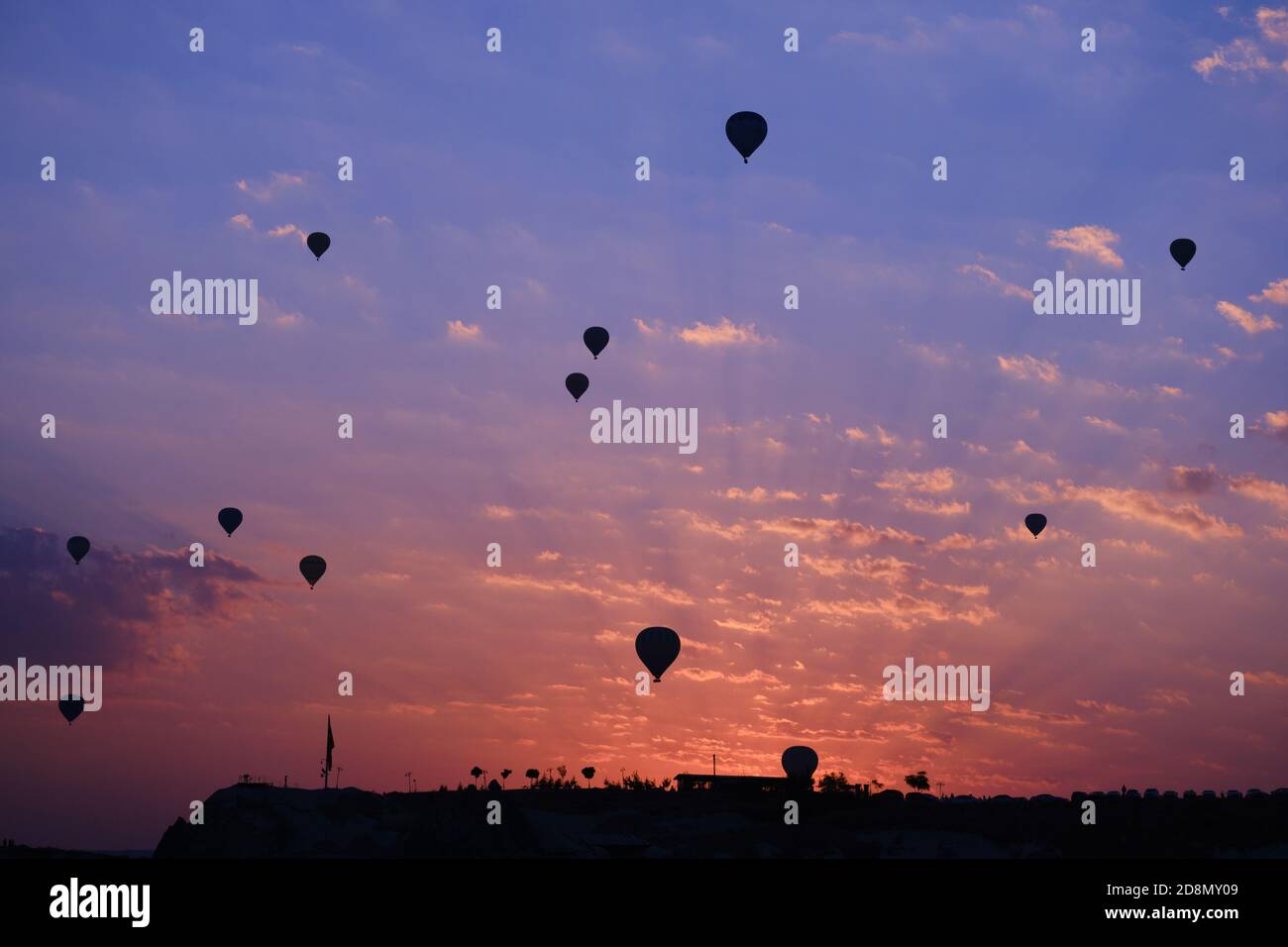 Hot air balloons silhouette in Goreme valley at sunrise, Cappadocia, Turkey Stock Photo