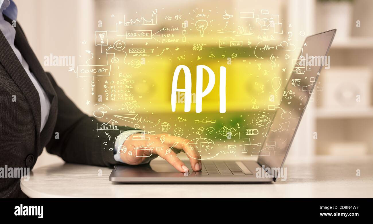 hand working on new modern computer with API abbreviation, modern ...