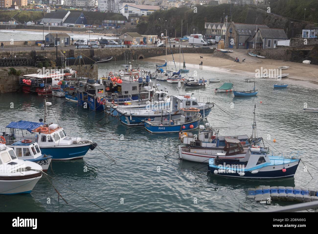 Fishing boats resting in Newquay harbour on the Cornish coast Stock Photo