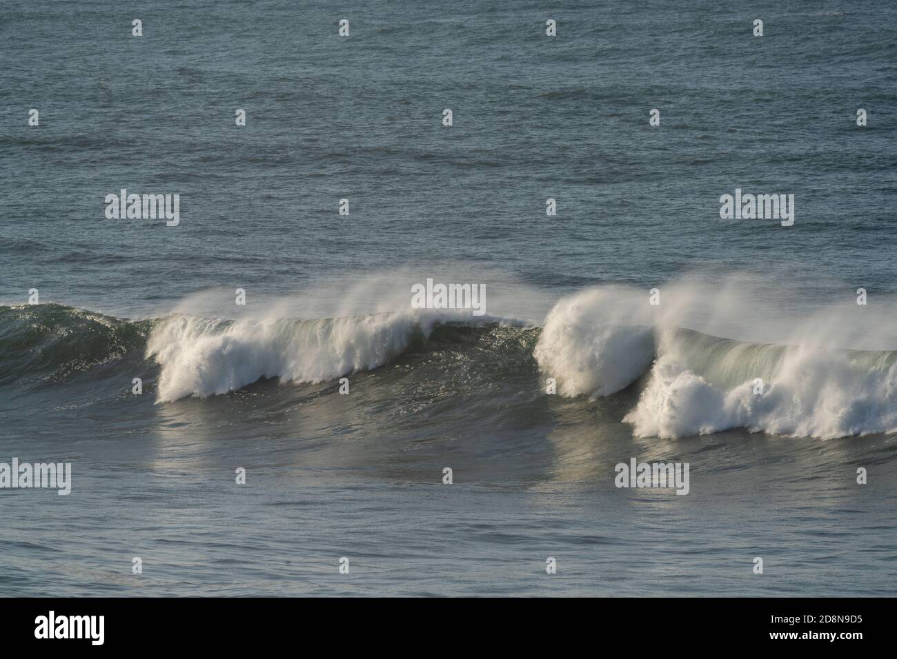 Detail view of large waves breaking in the open ocean during a tropical storm Stock Photo