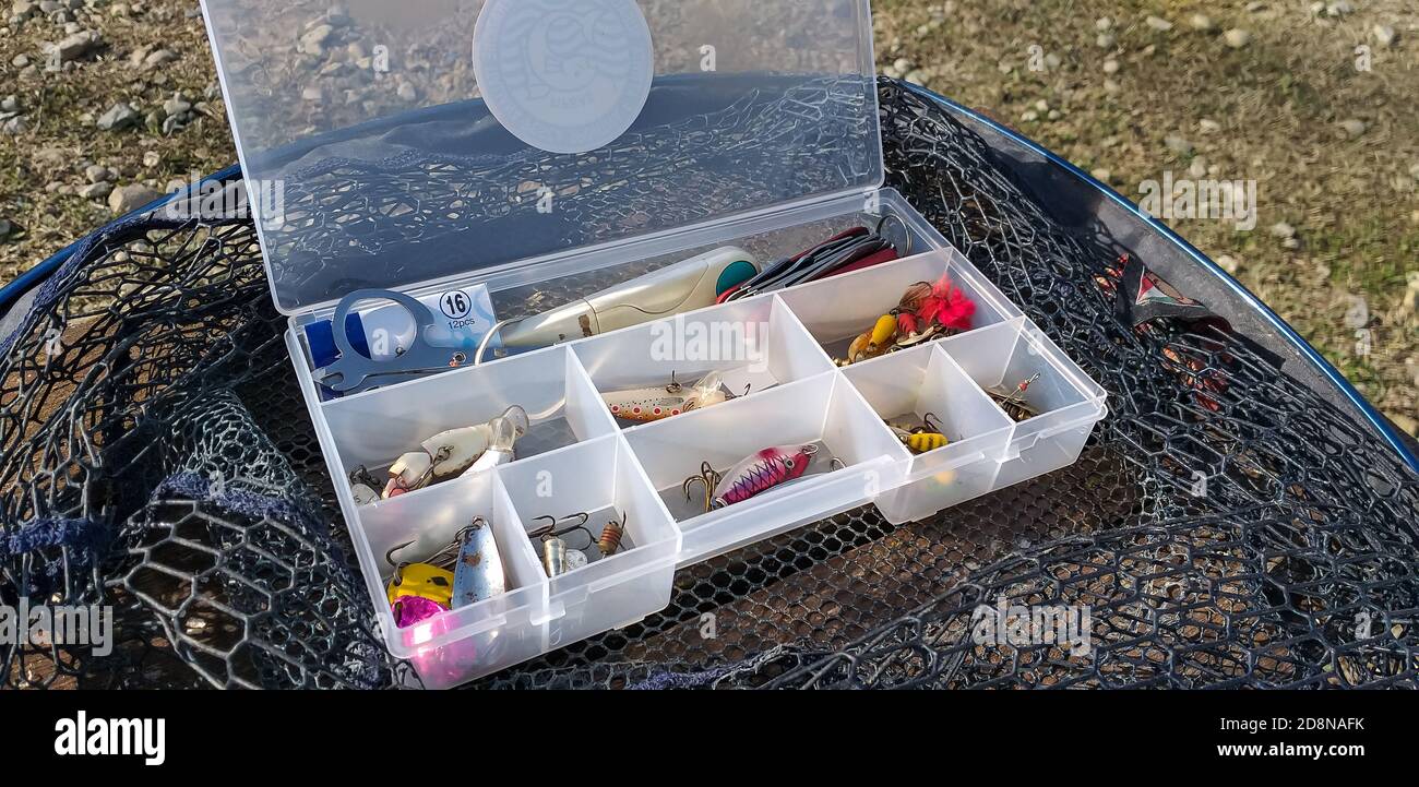 Trout fishing equipment in the lake with the spinning technique Stock Photo Alamy