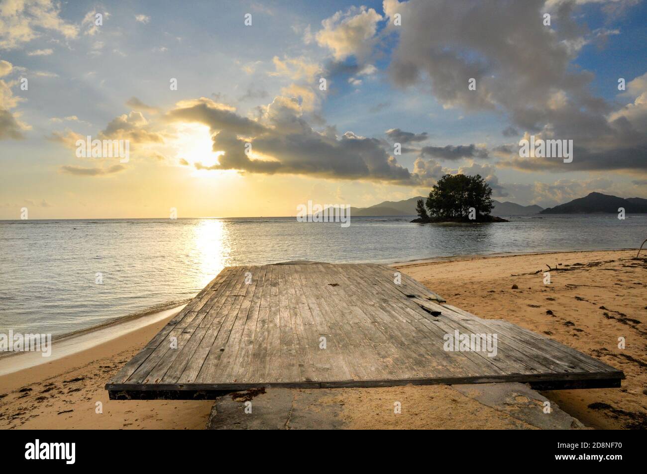 Wooden deck on the beach surrounded by the sea during a beautiful ...