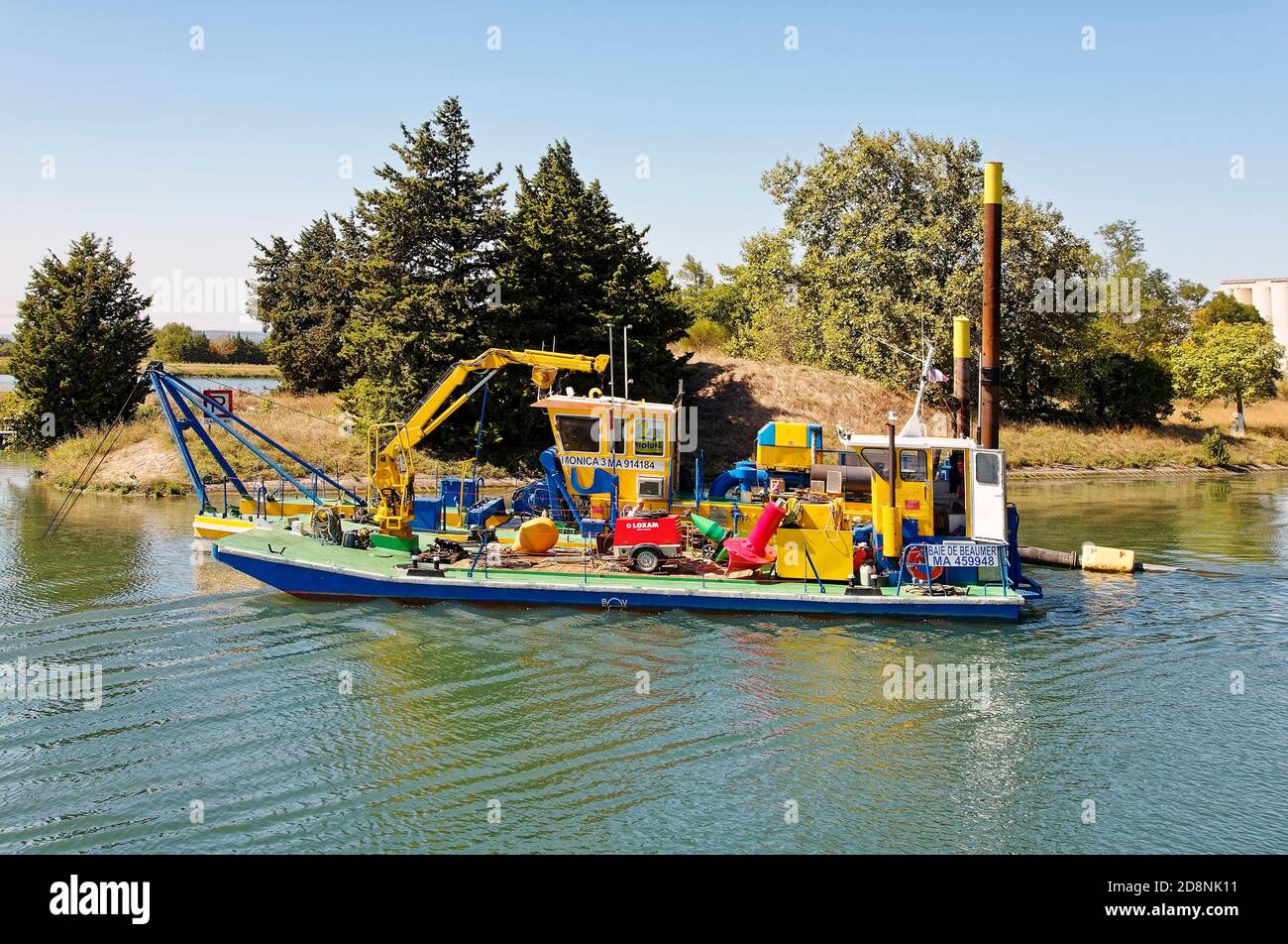 workboat, colorful equipment, industry, business, Rhone River, water, Provence, France; summer; horizontal Stock Photo