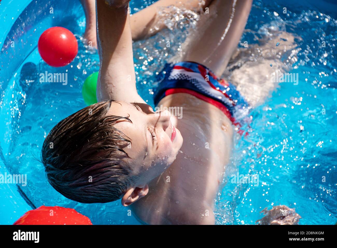 Kid jumping in the pool hi-res stock photography and images - Alamy
