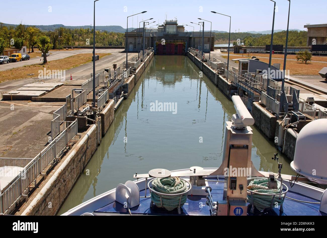 Bollene Lock, riverboat entering, Rhone River, 71 foot difference, navigable, waterway technology, marine,  Provence, France, summer, horizontal Stock Photo