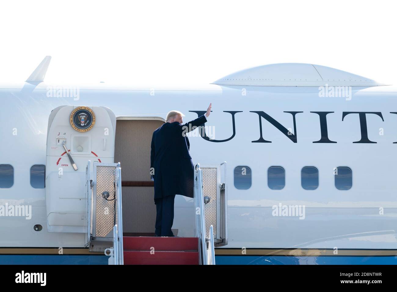 Ewing, New Jersey, USA. October 31, 2020: U.S. President Donald J. Trump waves as he departs Trenton Mercer Airport in Ewing, New Jersey after a campaign stop in near by Newtown PA. Trump will also stop n several towns in Pennsylvania including Butler and Reading, PA Credit: Brian Branch Price/ZUMA Wire/Alamy Live News Credit: ZUMA Press, Inc./Alamy Live News Stock Photo