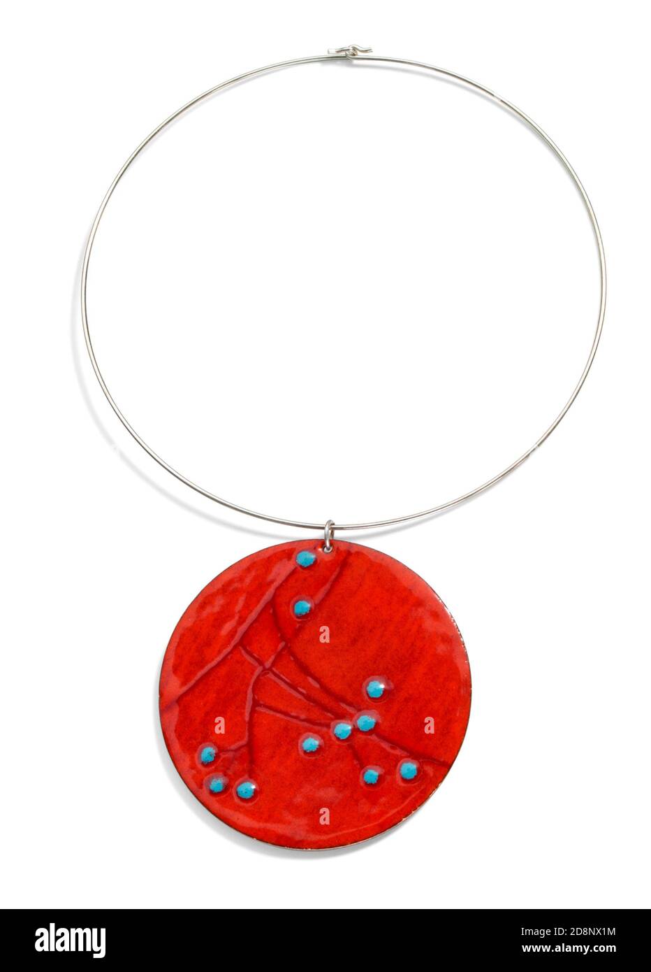 hand painted red and blue enamel round pendant on a choker necklace photographed on a white background Stock Photo