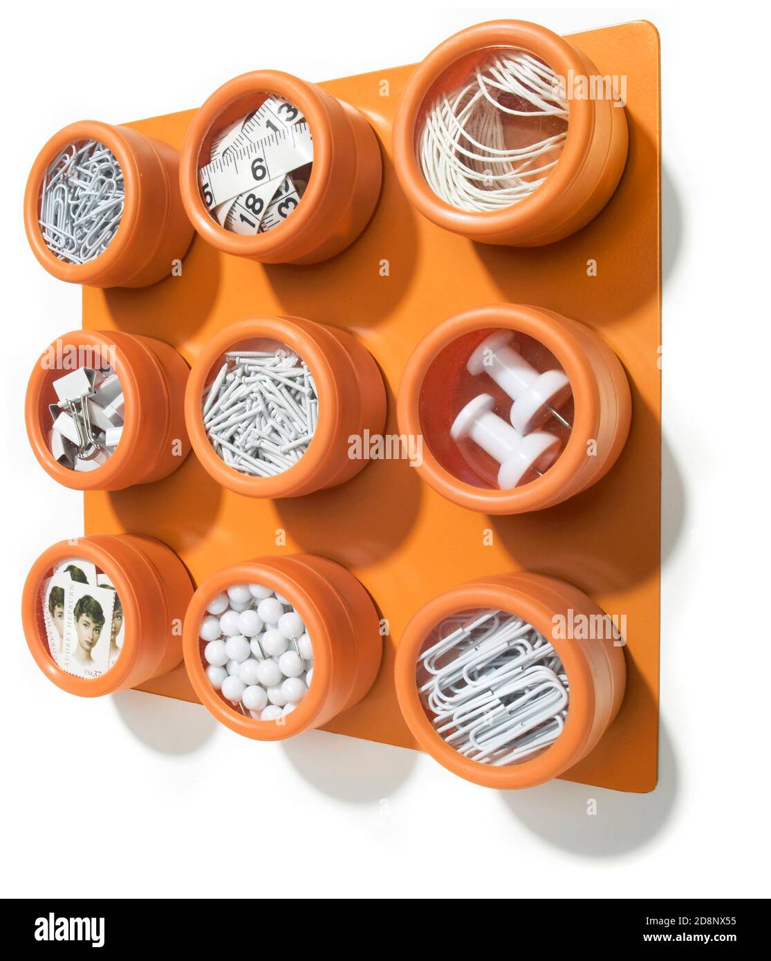 soho orange wall-mounted spice rack filled with white office supplies ...