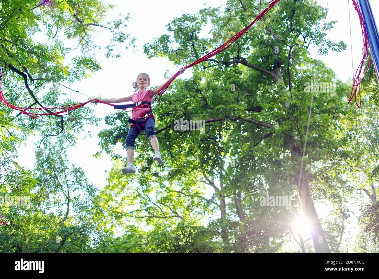 Children playing an elastic hi-res stock photography and images - Alamy