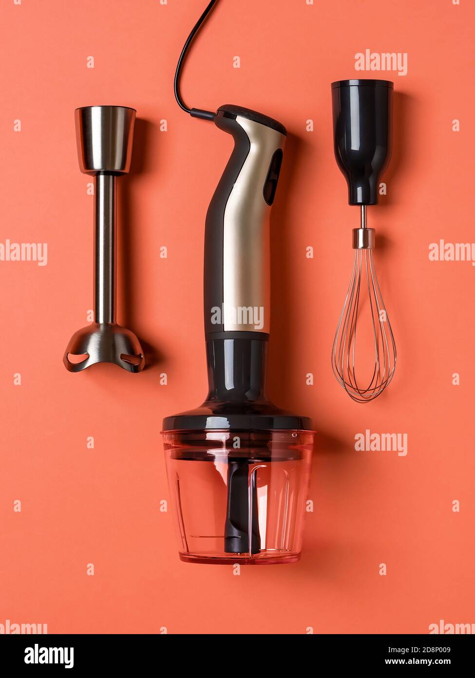 https://c8.alamy.com/comp/2D8P009/immersion-hand-blender-whisk-for-whipping-and-chopper-cup-on-a-coral-background-modern-electric-kitchen-appliances-for-making-sauces-smoothies-2D8P009.jpg