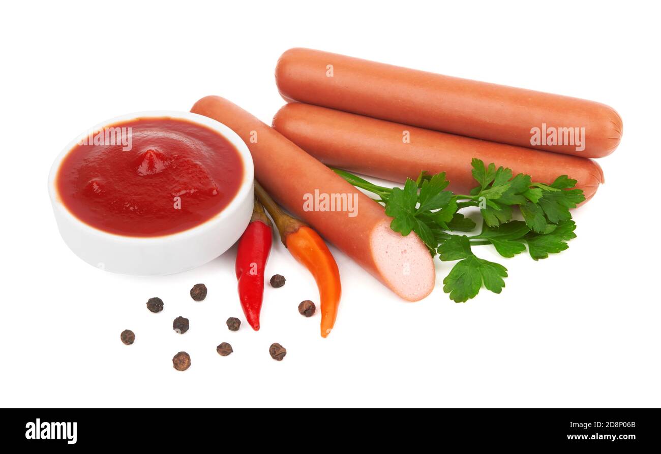Fresh sausages with parsley leaves isolated on white background Stock Photo