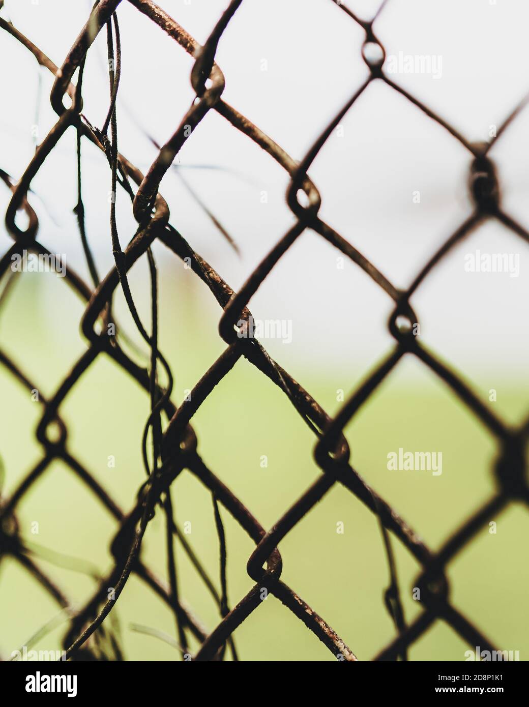Trapped behind a rusty chain link fence Stock Photo Alamy