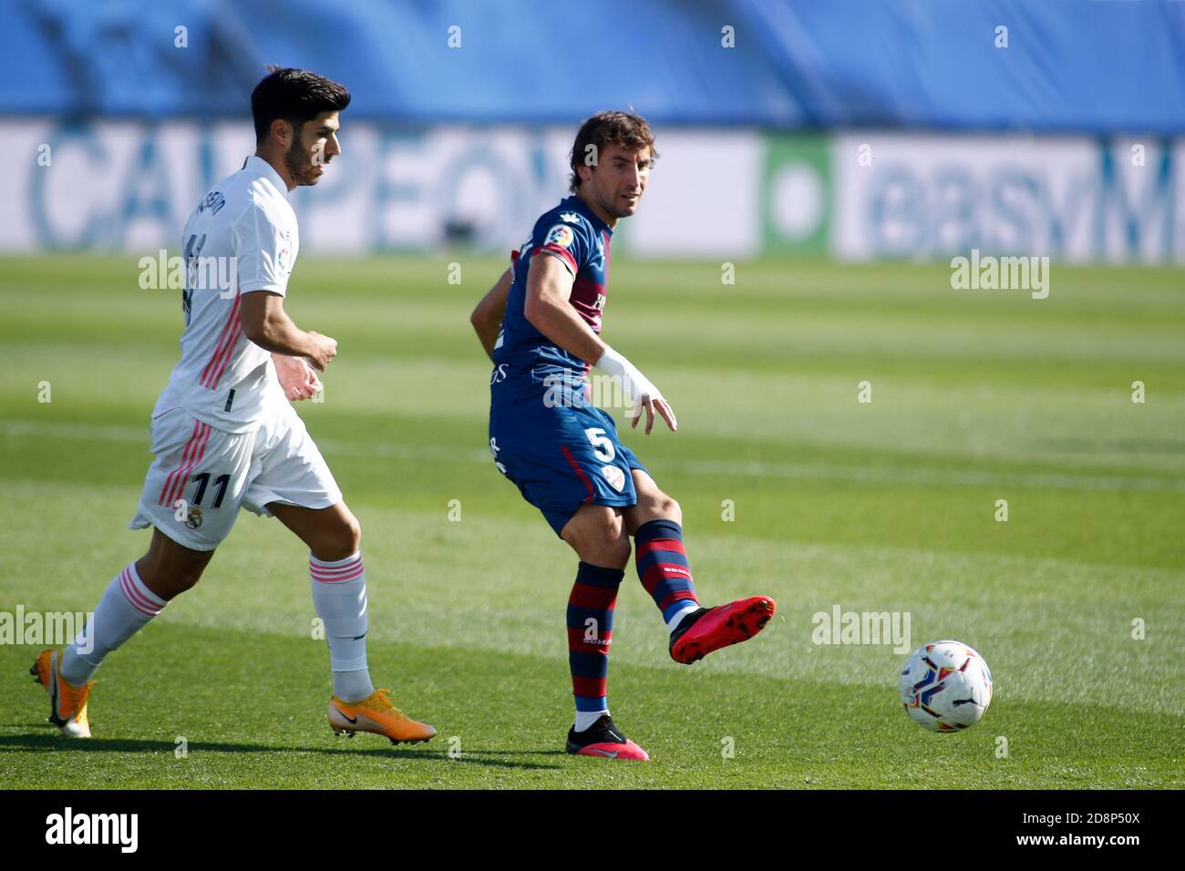 Madrid, Spain. 31st October, 2020. Pedro Mosquera of Huesca and Marco Asensio of Real Madrid in action during the Spanish championship La Liga football match between Real Madrid and SD Huesca on October 31, 2020 at Alfredo Di Stefano stadium in Valdebebas, Madrid, Spain - Photo Oscar J Barroso / Spain DPPI / DPPI Credit: LM/DPPI/Oscar Barroso/Alamy Live News Stock Photo