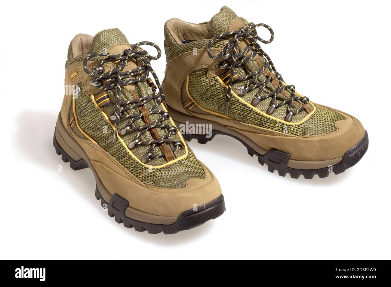tan and green teva boots photographed 