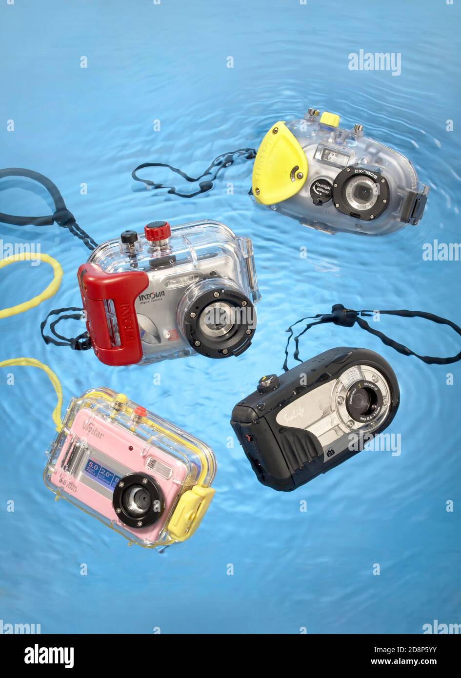 four underwater cameras photographed on a blue background Stock Photo ...