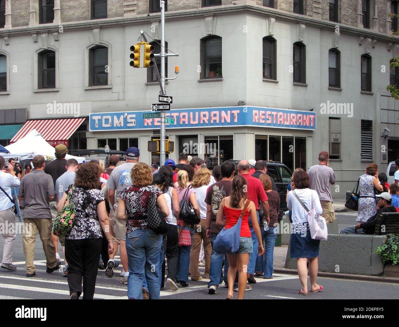New York, NY, USA - September 13, 2008:  People head towards Tom’s Restaurant which was used as the exterior shot for Monk’s in popular sitcom Seinfel Stock Photo