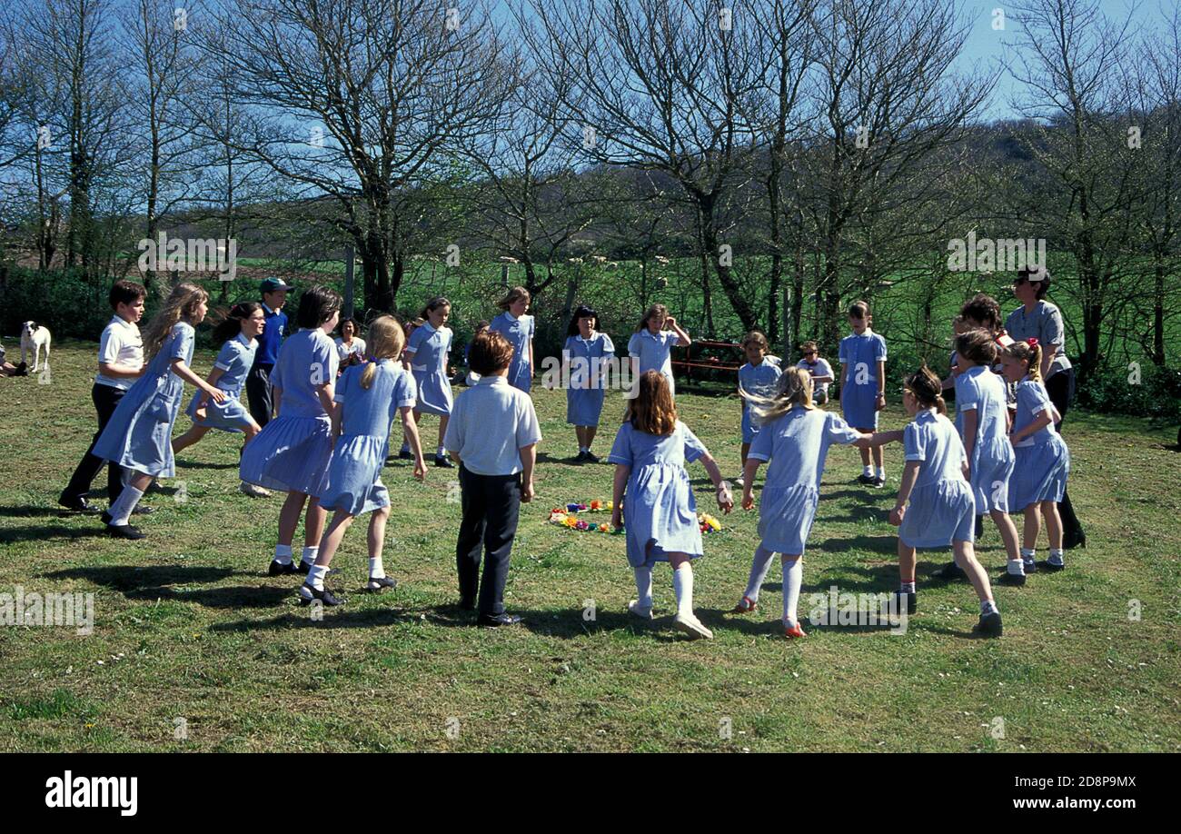 primary school children doing a traditional english country dance in