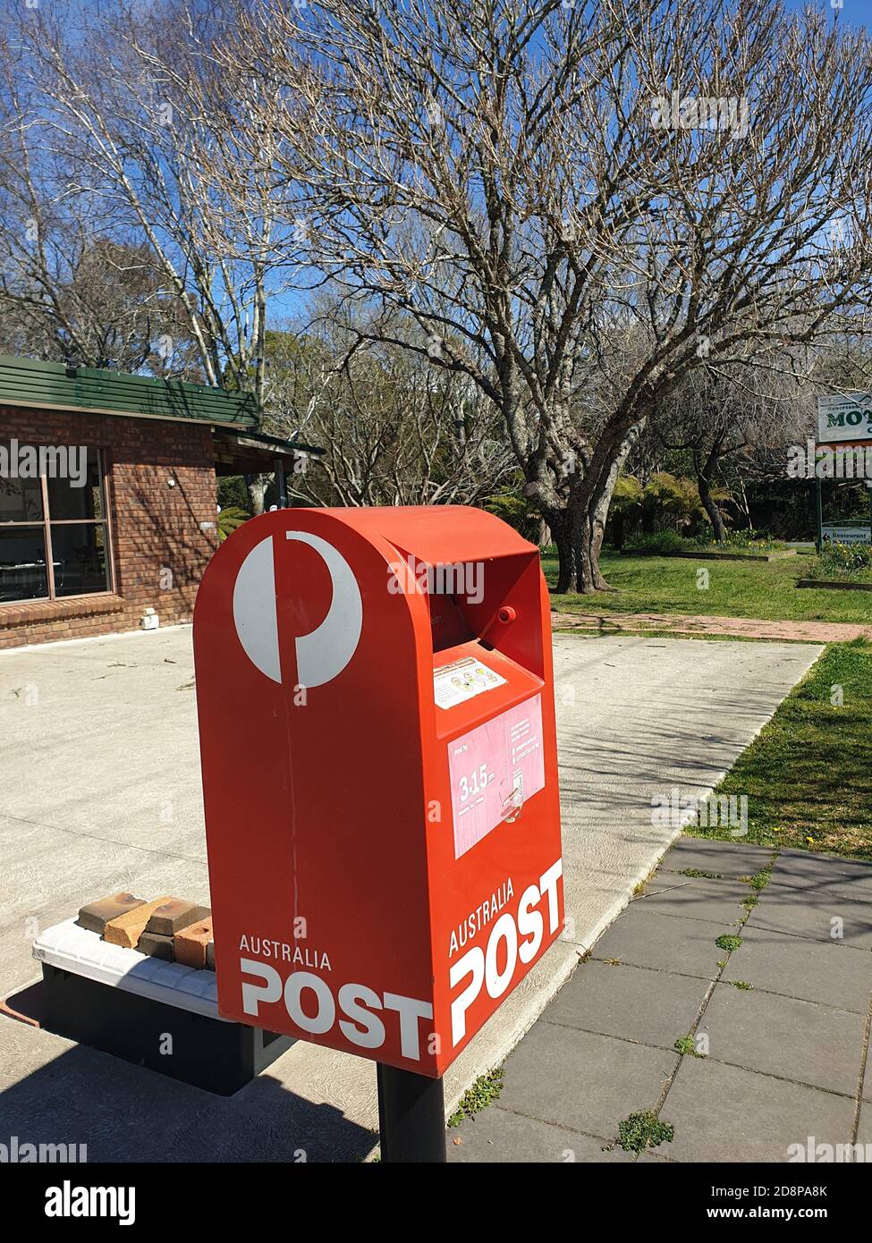 Red Post Box Aussie SOUTHERN HIGHLANDS, AUSTRALIA - Sep 13, 2020: Red box ubicated in ...