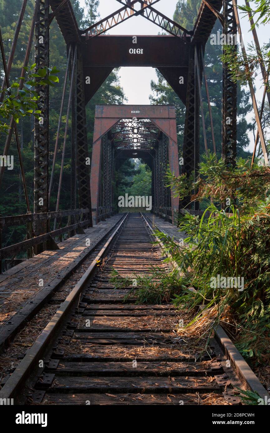 Northwestern Pacific Railway truss bridge over Larabee Creek in Humboldt County, California. Built in 1910 the rail tracks are no longer in use. Stock Photo