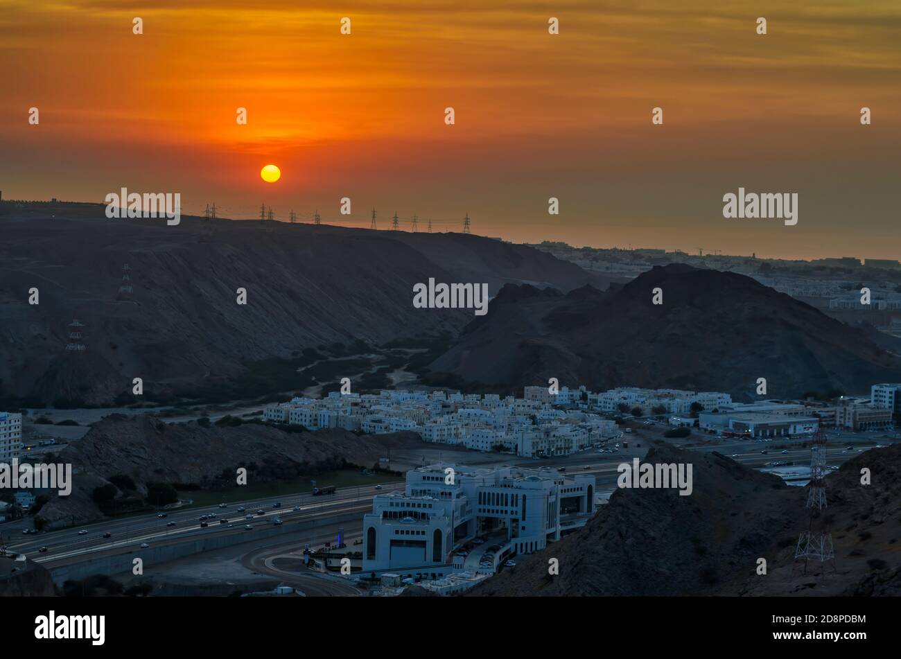 Glorious sunset over Muscat city - Golden hour shot taken from a hilltop Stock Photo