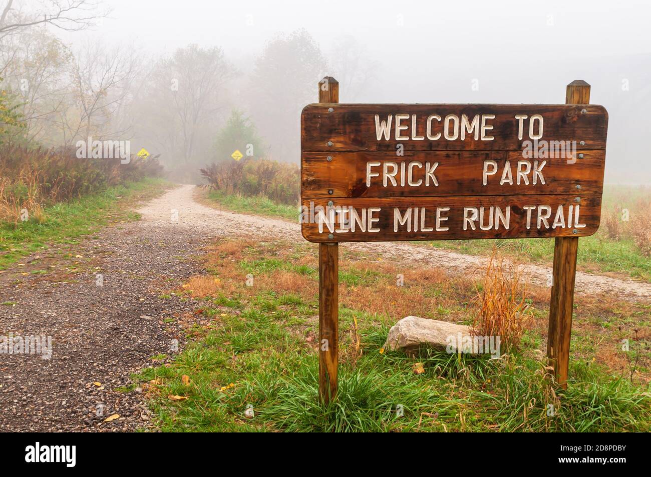 The to Frick Park Nine Mile Run Trail sign on a foggy fall