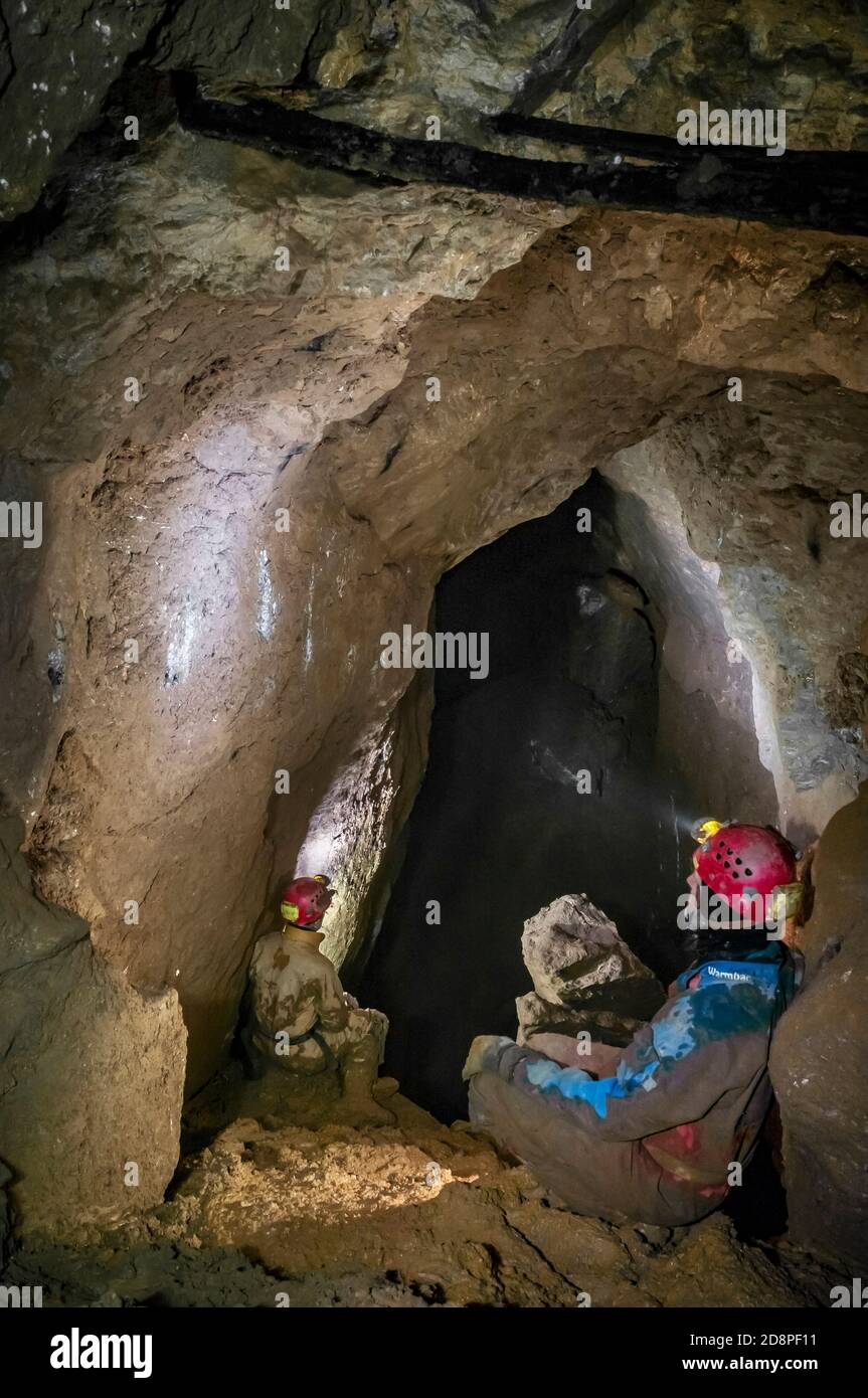 Large natural vein-cavity cave chamber with  miners' wooden stemples still in the roof from the 1770s in Speedwell Cavern in Castleton, Derbyshire. Stock Photo